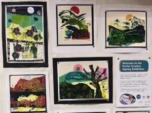Collages of landscapes on a display board.